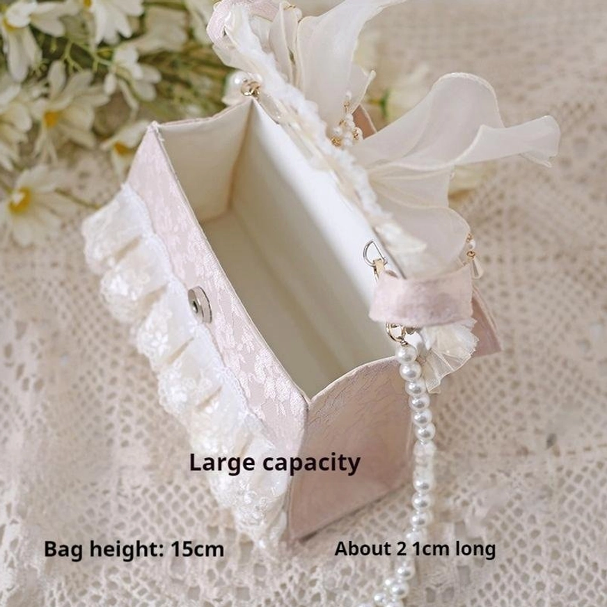 Opened lolita handbag displaying spacious interior with size specifications 15cm height 21cm length with pearl chain strap
