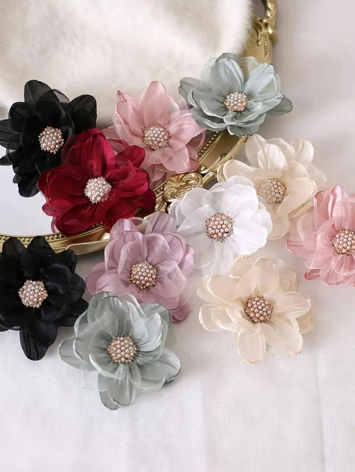 Assorted organza flower lolita hairpins in black wine red pink neutral tones detailed view