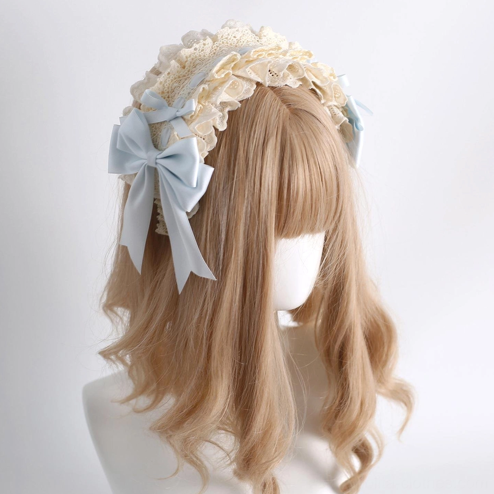 Detailed view of lolita headdress set showcasing fine lace craftsmanship ruffles bows and pearl embellishments quality construction