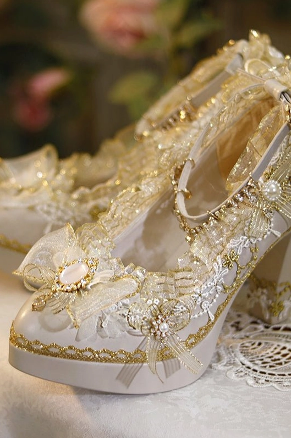 Close-up detail shot of single luxury Lolita high heel showcasing intricate gold thread embroidery layered lace decorations and pearl trims