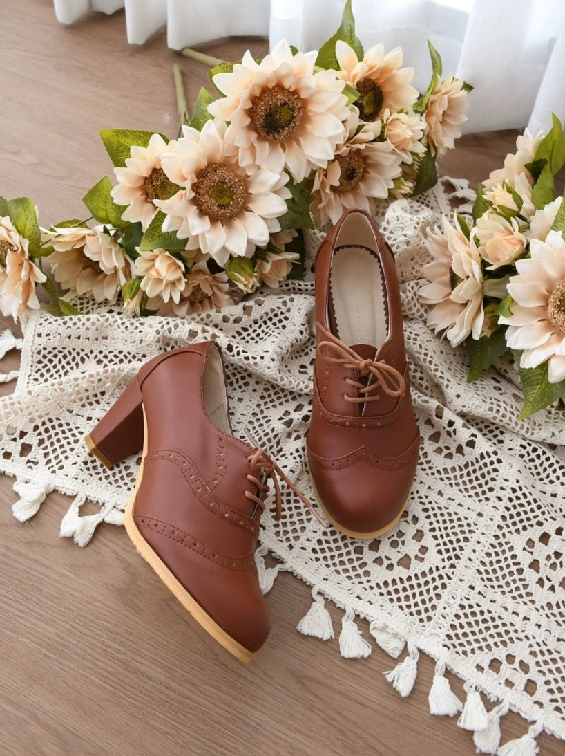 Handcrafted lolita heel shoes leather lace-up closure detail showing hand-stitched leather laces and adjustable fit system