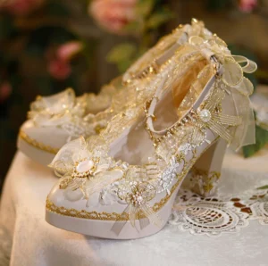 Front three-quarter closeup of luxury Lolita high heels showing opal-style gem center bow and sheer organza ribbon ankle strap details