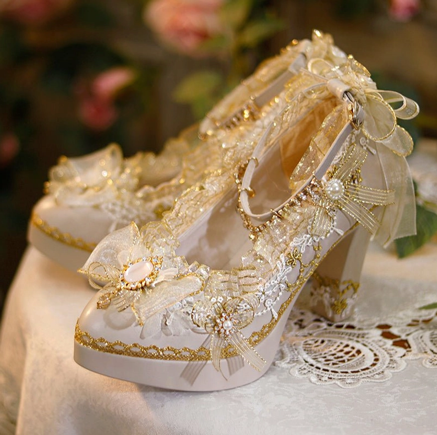 Front three-quarter closeup of luxury Lolita high heels showing opal-style gem center bow and sheer organza ribbon ankle strap details