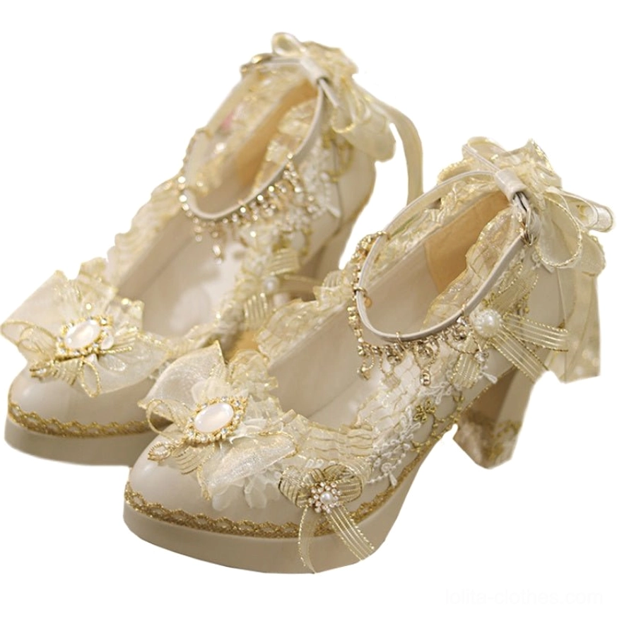 Overhead flat lay of luxury pointed-toe Lolita heels with large front pearl-centered bow and ruffled heel collar trim