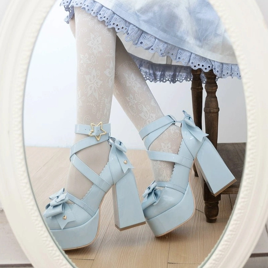 Side close-up feet wearing blue patent lolita heels crisscross straps white stockings block heel shape