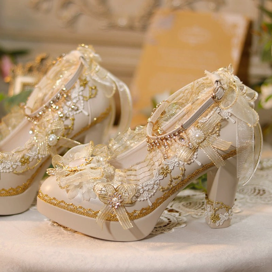 Side profile of handmade Lolita wedding tea party shoes featuring ankle strap with sheer ribbon bow and delicate floral lace appliques