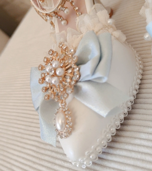 Lolita high heel shoe light blue satin material with ankle-strap buckle design and pearl embellishment detail photography