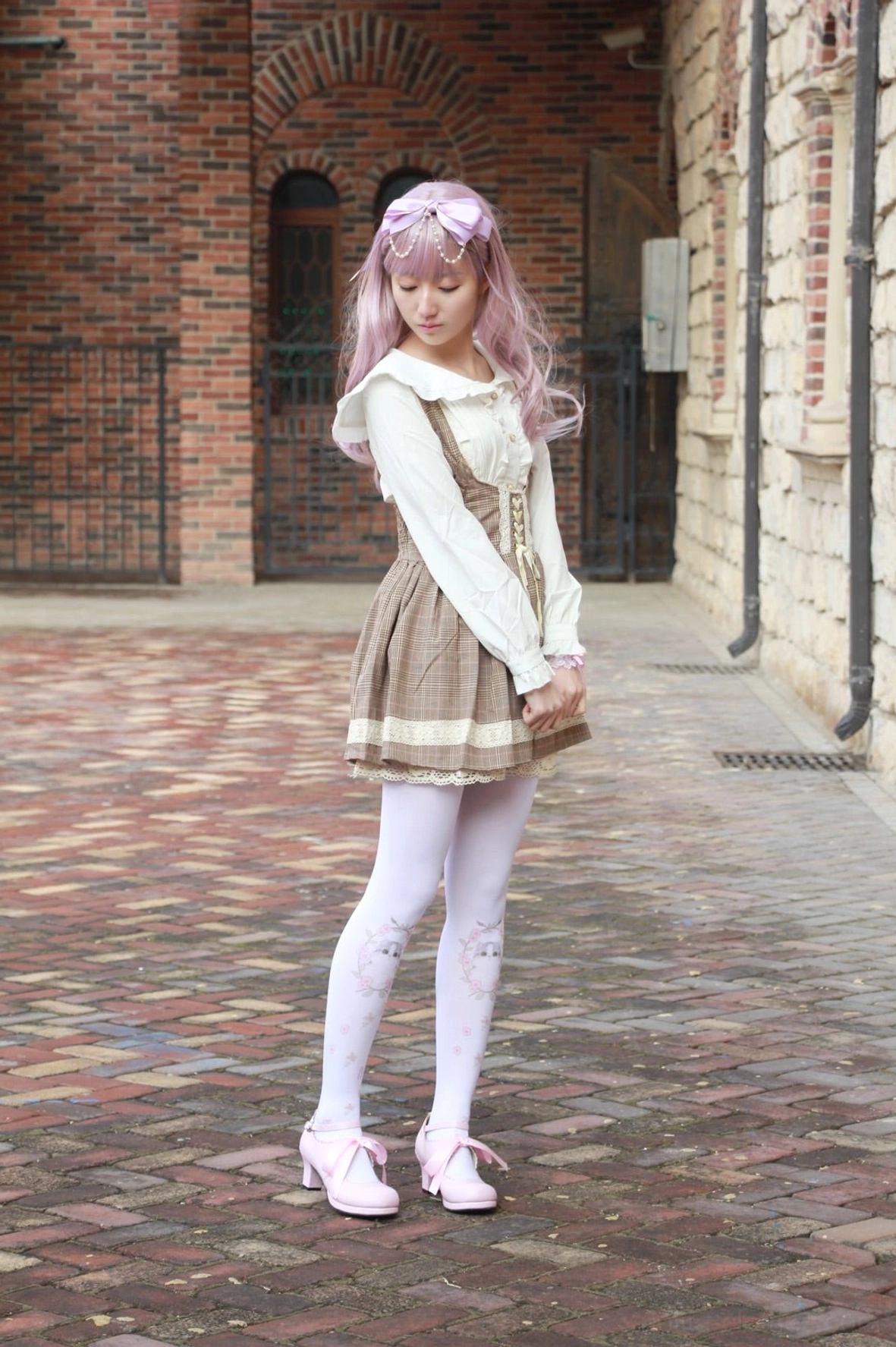 Lolita high heel shoes styled with pastel JSK dress, Peter Pan collar blouse, and puffed sleeves in sweet lolita fashion coordinate for tea party events