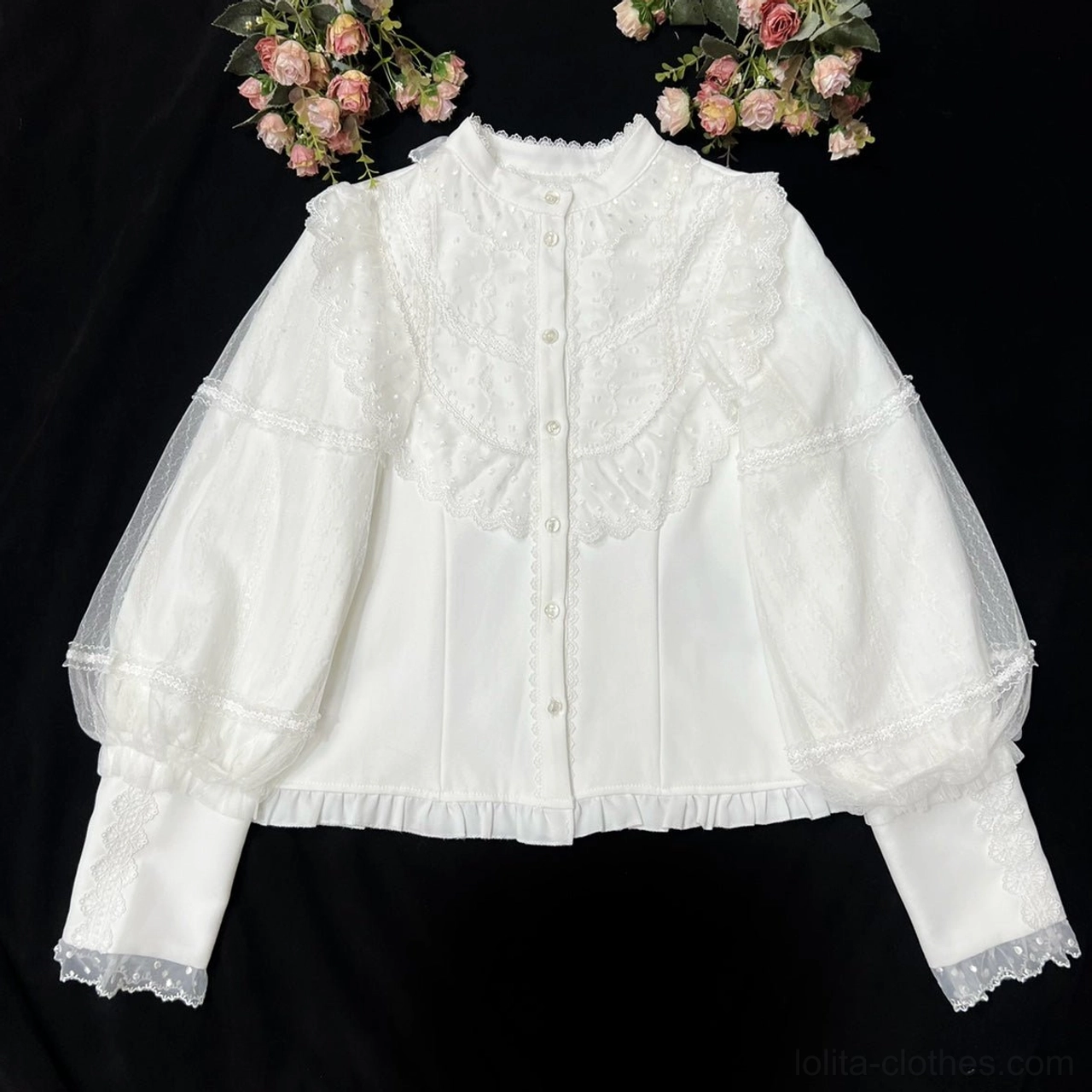 Back view of black high-waisted Lolita skirt with elaborate lace-up corset details and ruffled hem paired with cream blouse, showcasing intricate waistband construction and vintage-inspired silhouette
