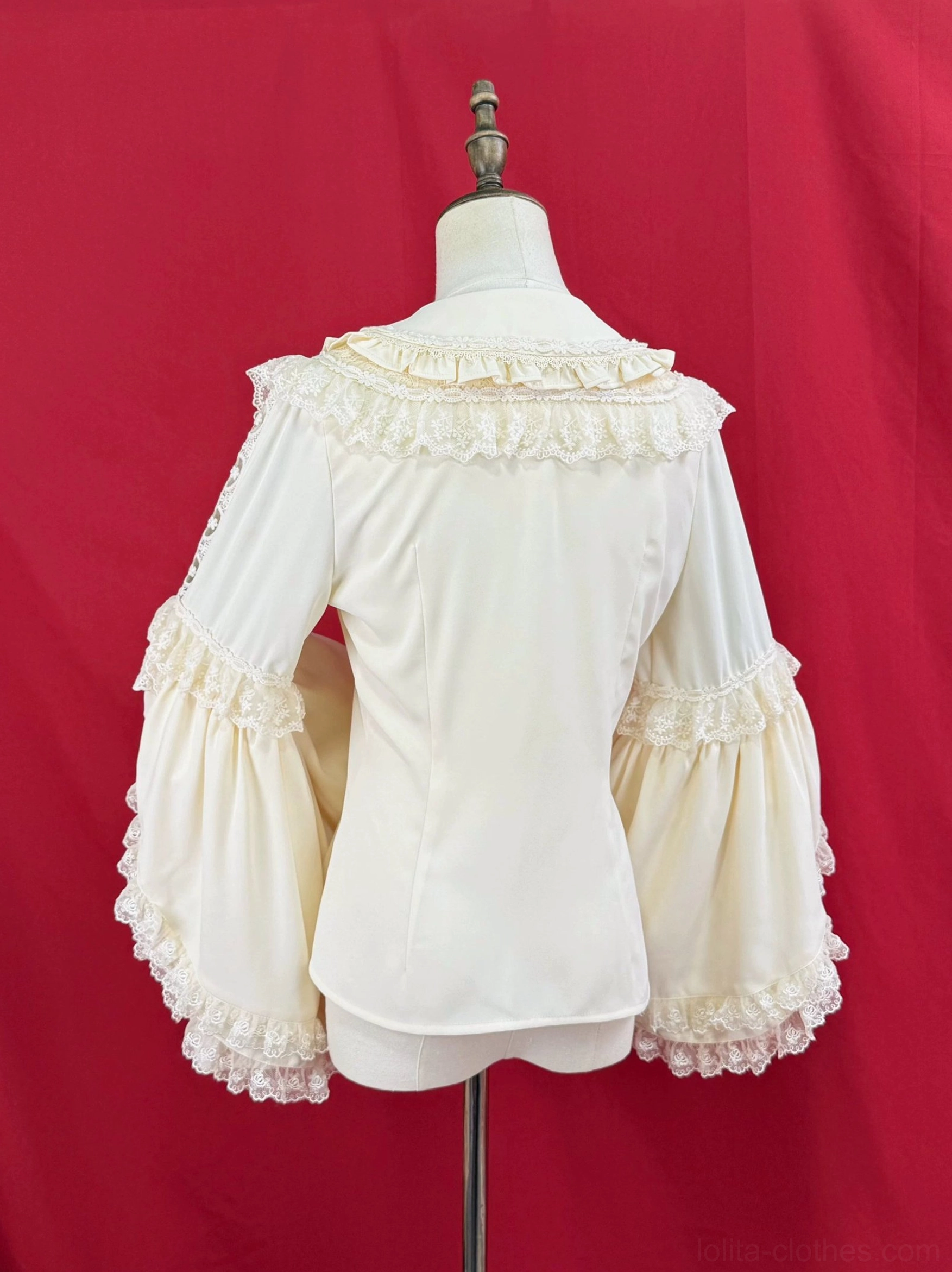 Lolita hime sleeve blouse back view, cream white, showing ruffled Peter Pan collar at back, puff sleeves with ruffled cuffs, clean plain back design