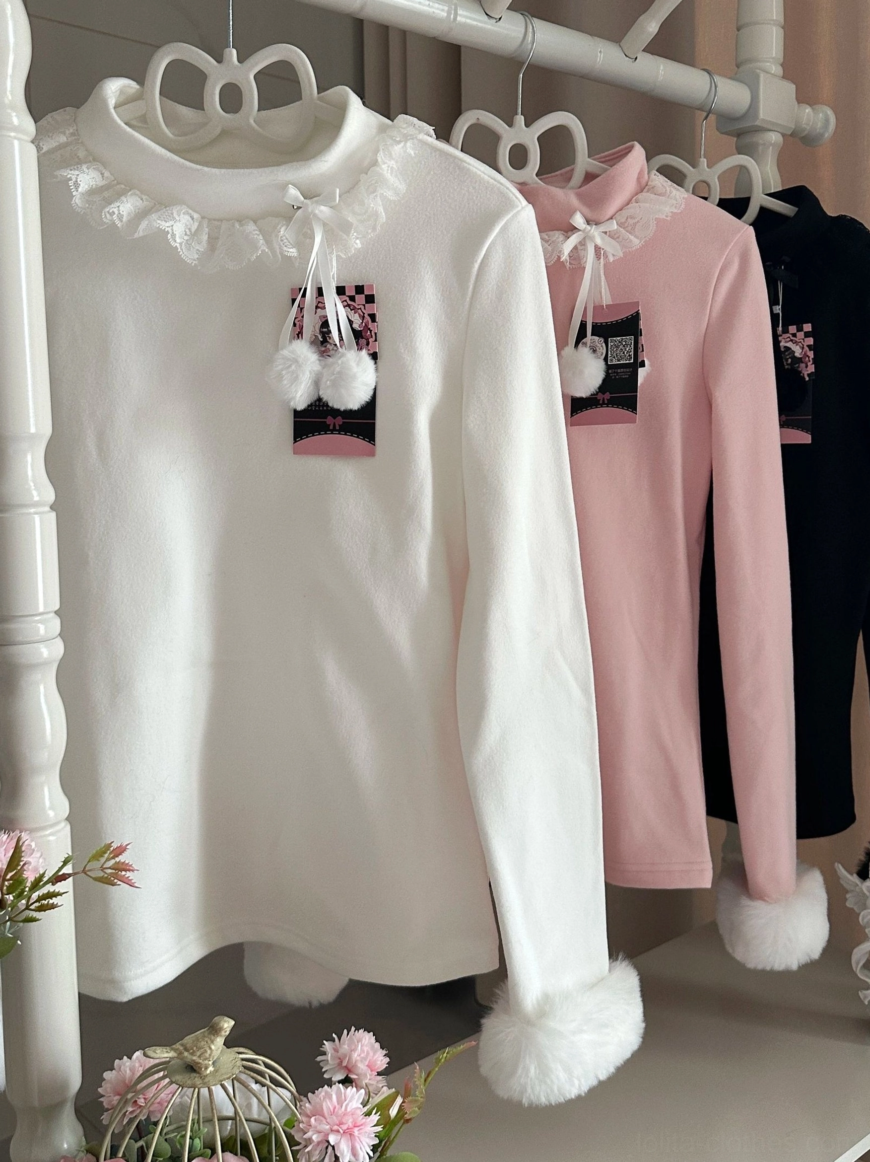 Off-white Lolita winter innerwear detail shot showing lace-trimmed turtleneck with fluffy pompom collar trims and fuzzy faux fur cuffs