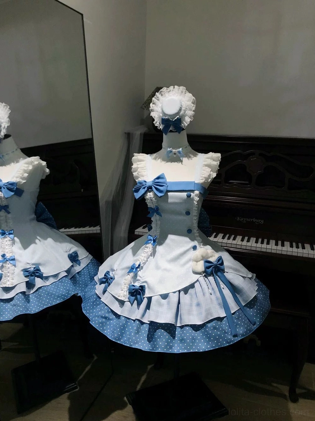 Lolita jumper skirt JSK back design features showing cloud-shaped hem decoration, tiered ruffled construction, dual waist bows, and classic sweet lolita silhouette architecture