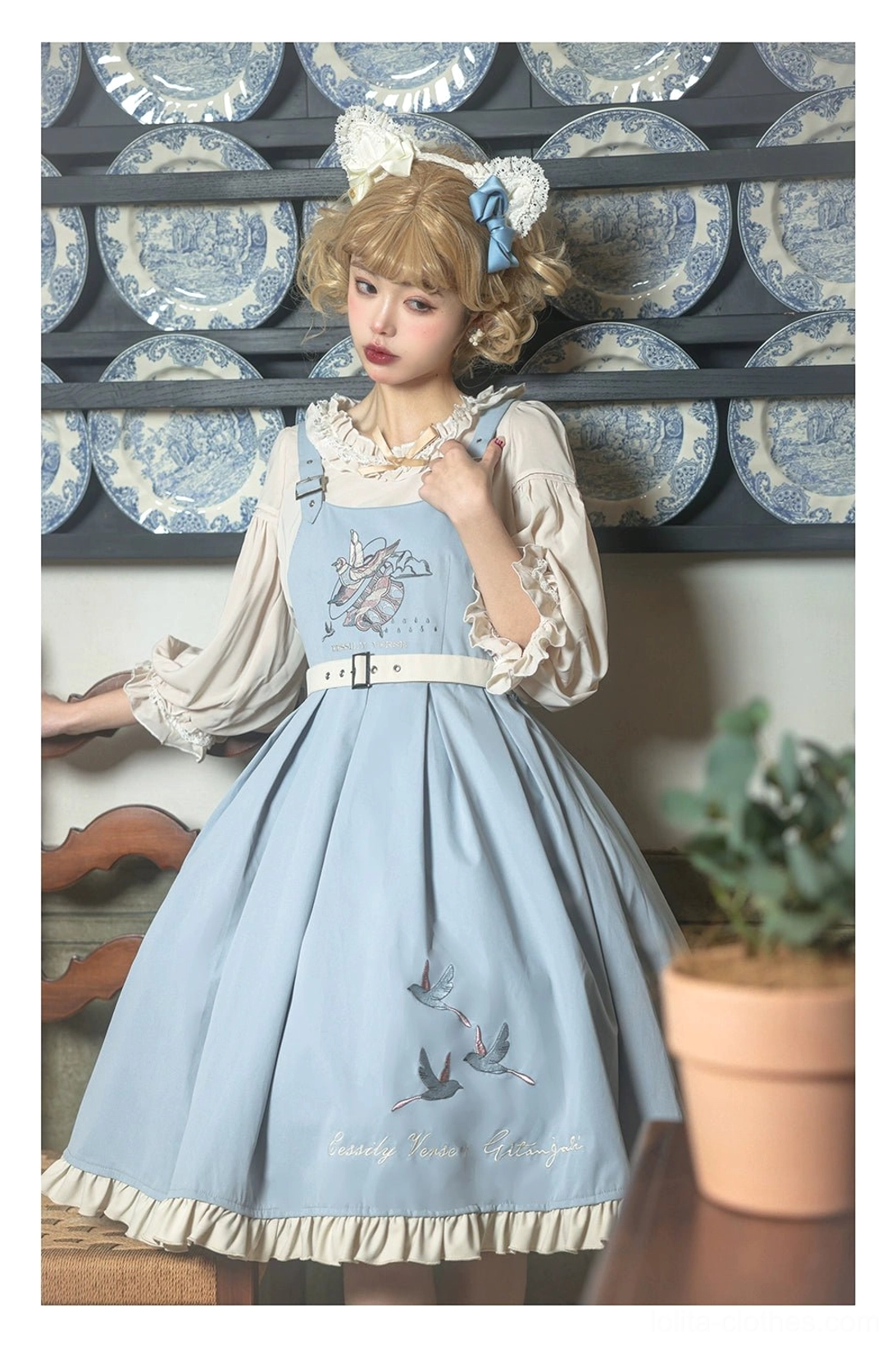 Bird embroidery Lolita JSK dress bust detail showing meticulous embroidered flying bird motifs decorative placement focal point