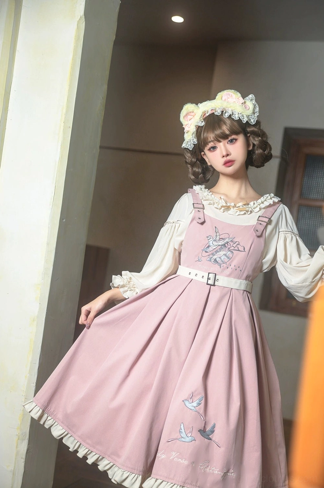 Bird embroidery Lolita JSK dress hem detail close-up showing flying bird motifs ruffled edge construction embroidery quality
