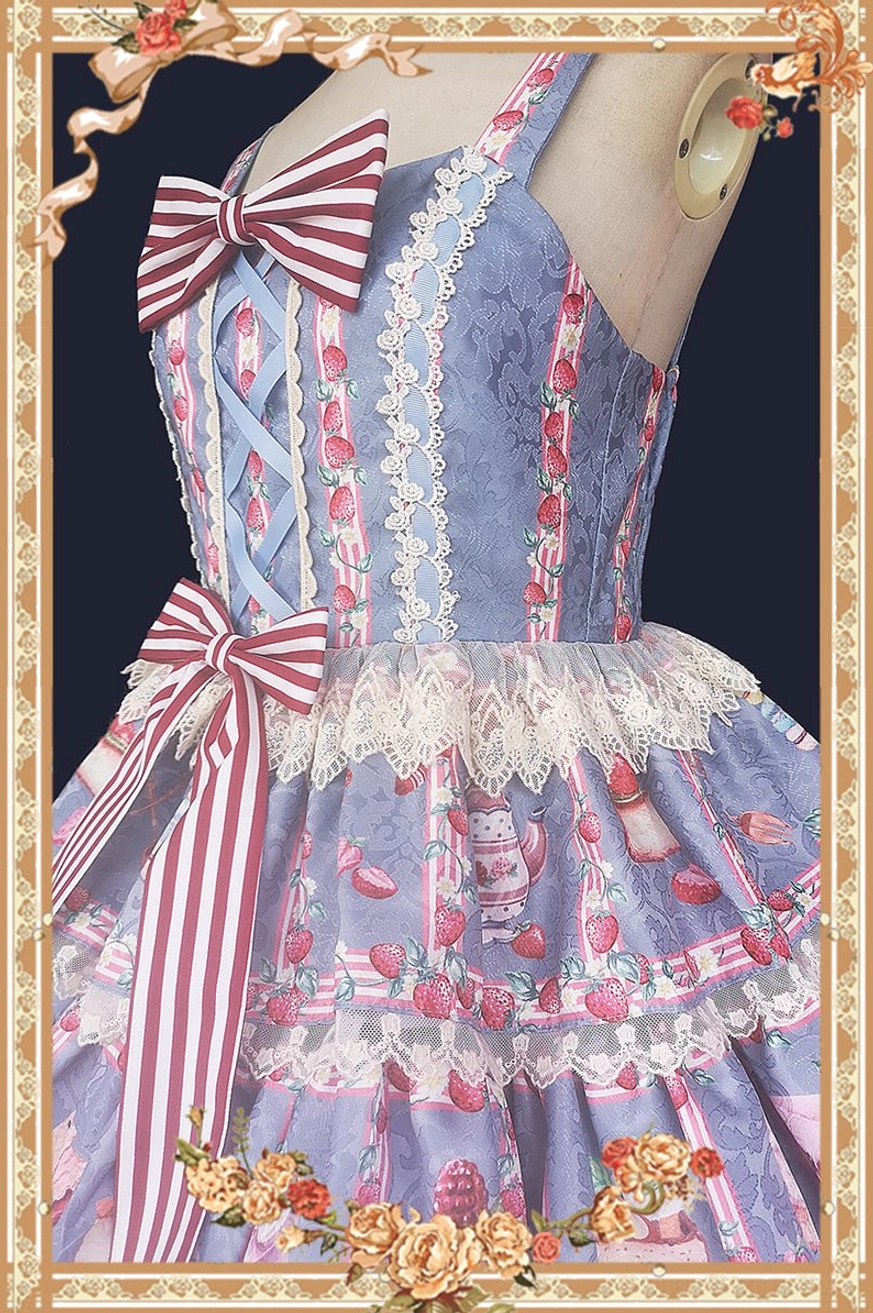 Close-up detail shot lolita JSK dress light blue fabric base three-quarter side view ornate golden floral decorative frame lace trim bodice striped bow decorations cross-laced bodice detail strawberry tea fabric prints