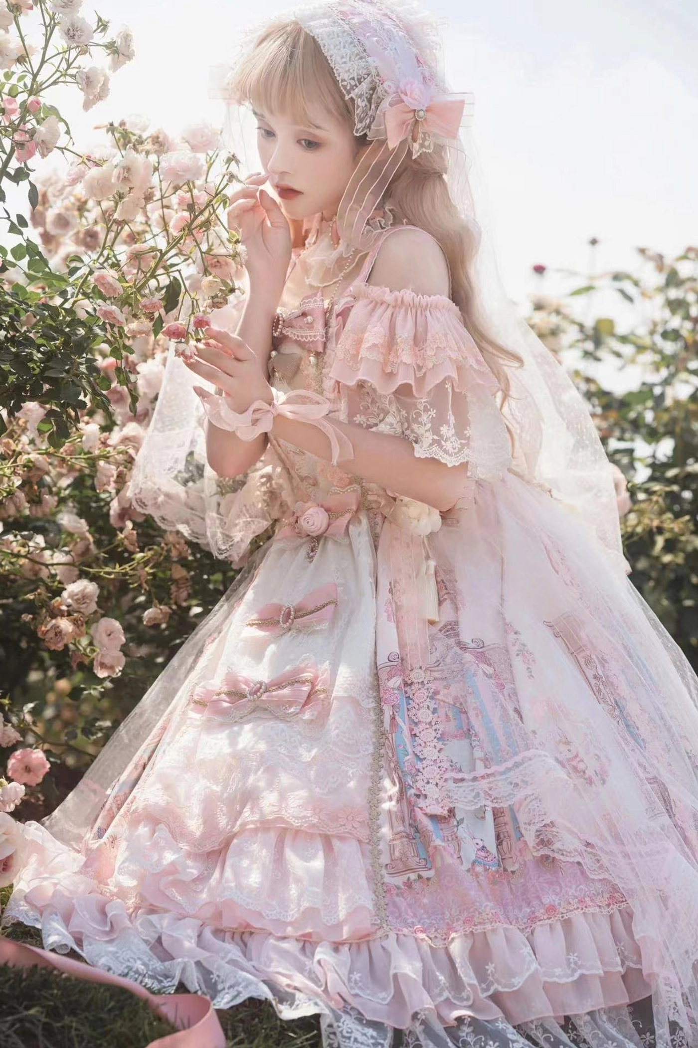 Off-shoulder wedding Lolita JSK dress close-up detail of ruffled lace sleeve trim and bow bodice decoration