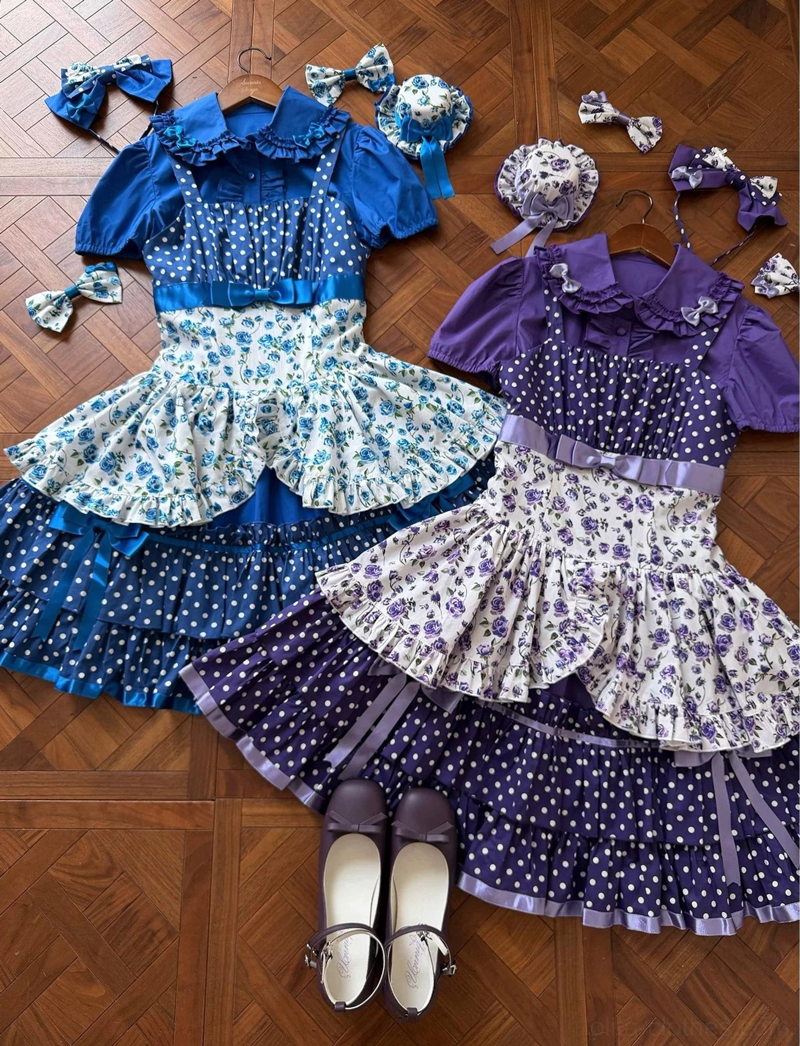 Blue polka dot and floral old school Lolita jumper skirt with Peter Pan collar blouse displayed on dress form, full-view showing constructed silhouette, layered skirt proportions, and garment structure