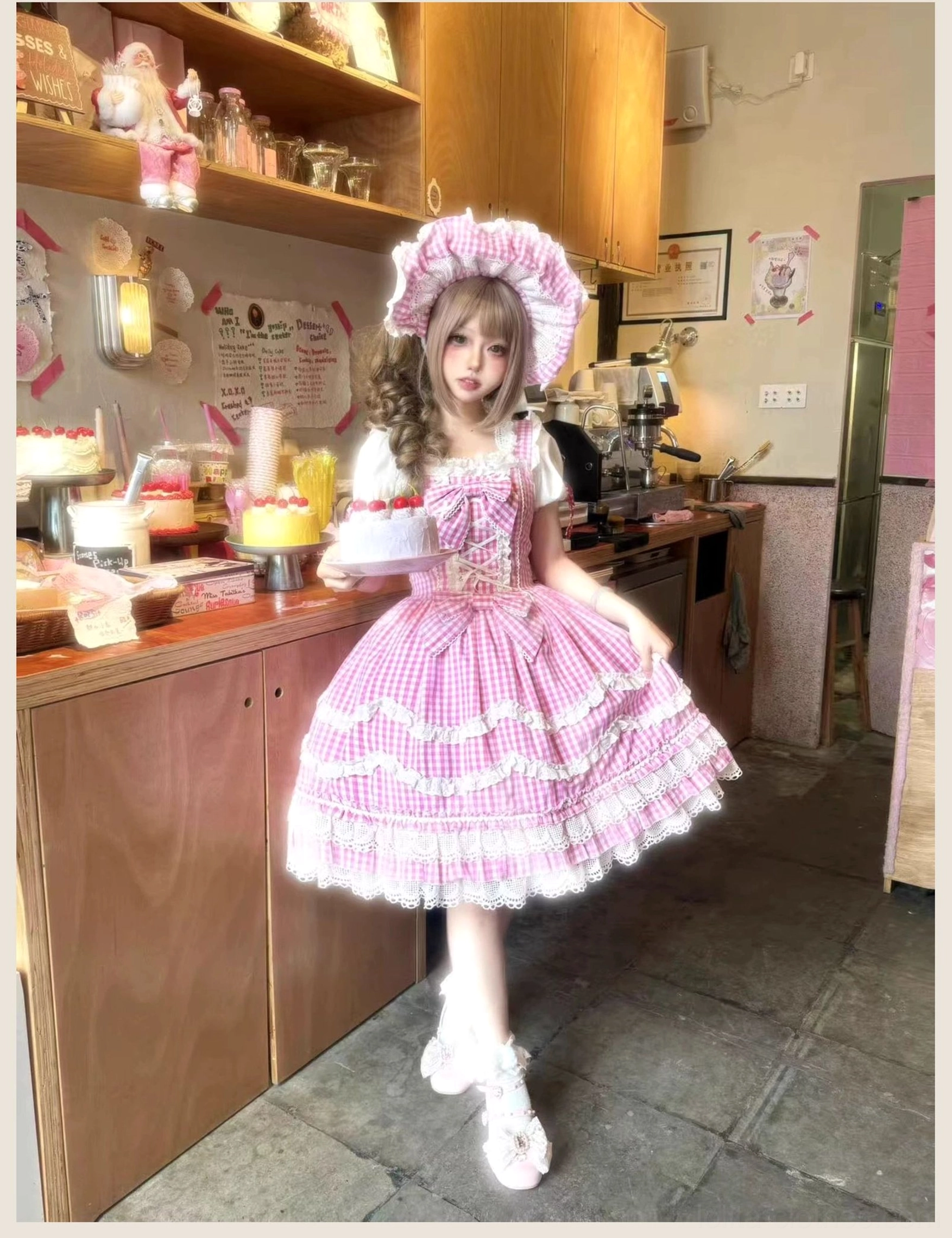 Pink gingham old school Lolita JSK dress hem detail, close-up view showing white petal-shaped ruffle layers and decorative lace trim at dress bottom