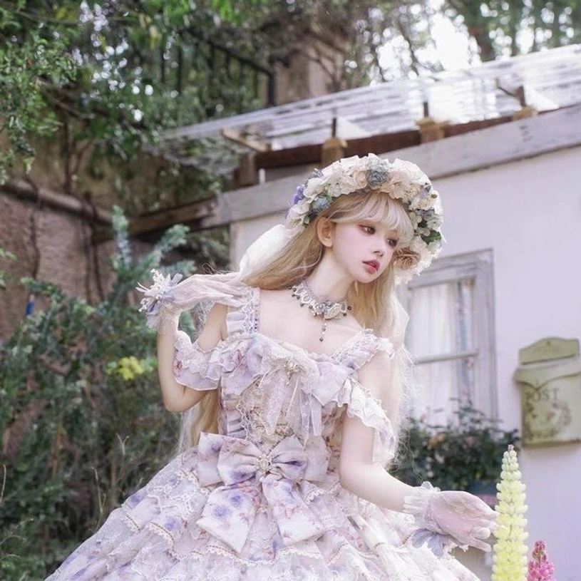 Included white multi-layered ruffle veil and arm sleeve accessories that come with enchanted garden lolita jsk princess dress, displayed separately showing complete package components