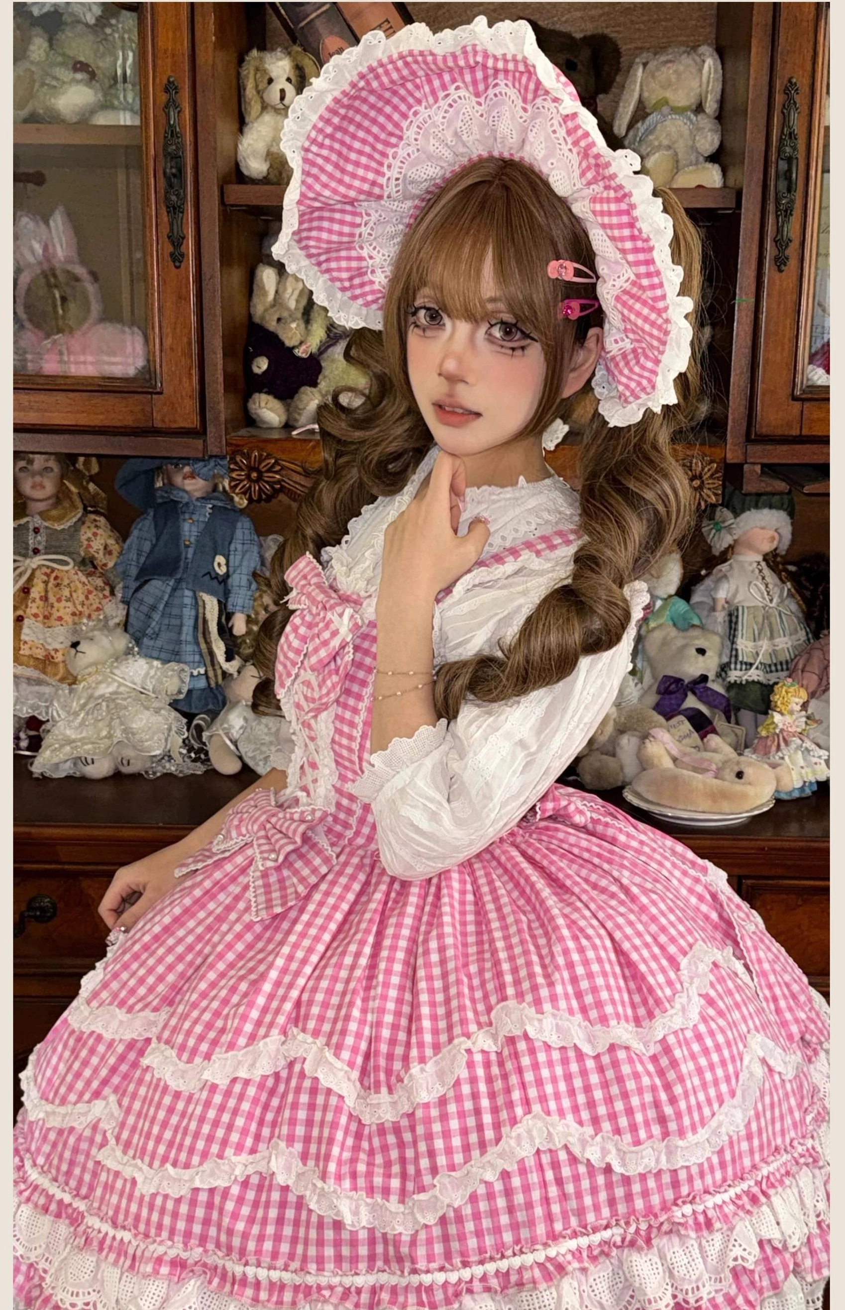 Pink gingham Lolita JSK dress with matching accessories collection, group shot showing bonnet, hair clips, and other coordinating pieces for complete lolita outfit