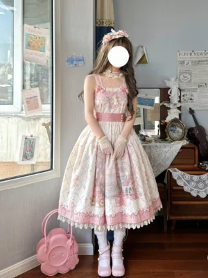 Romantic pink lolita jumper skirt with ribbon bows and gradient fairy tale print, square neckline detail with model wearing coordinating pink waist belt and vintage handbag