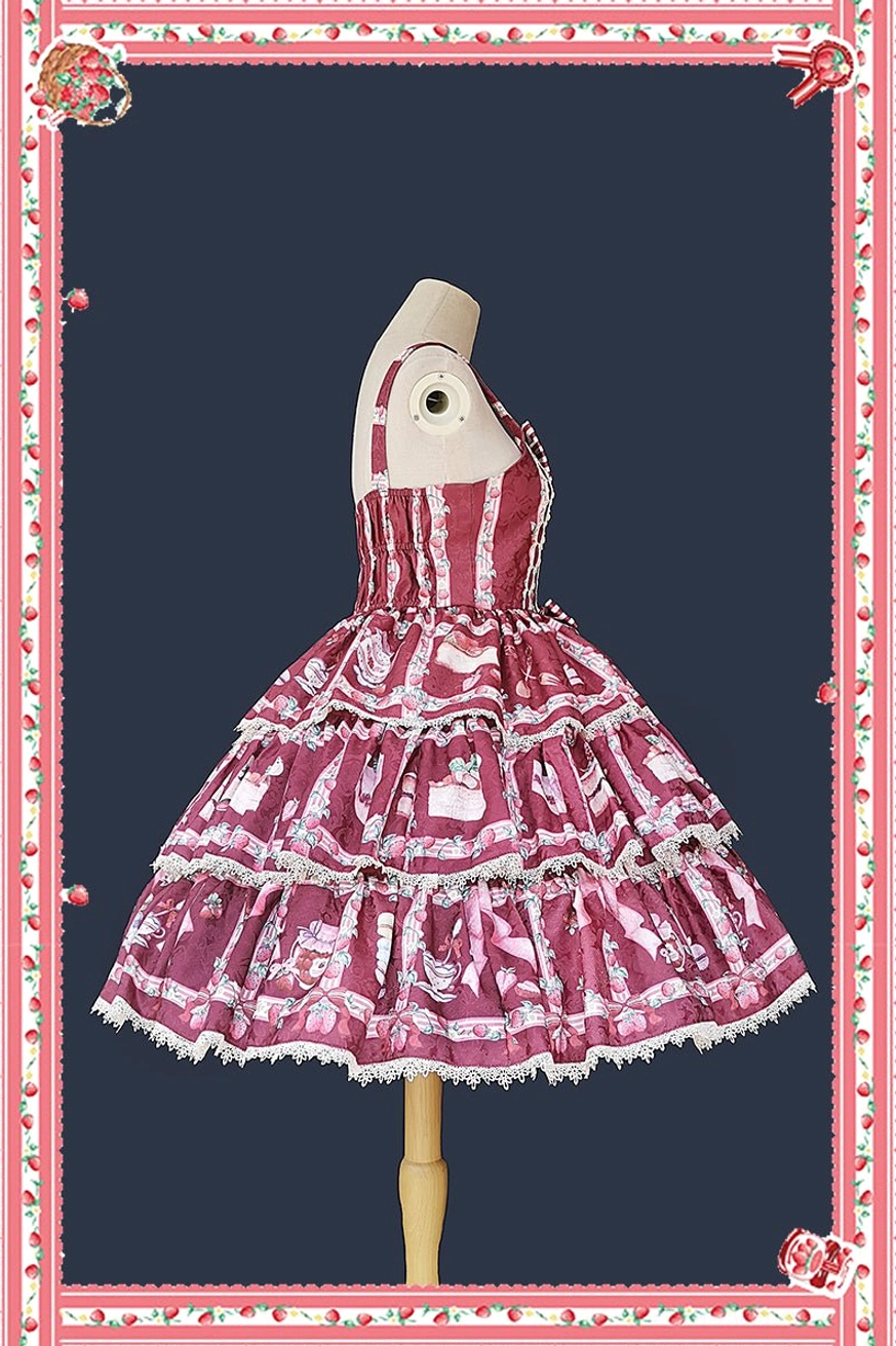 Tiered ruffle lolita JSK dress deep wine red colorway side three-quarter view dress form dark navy background floral frame single ruffled shoulder strap layered ruffle hem lace trim strawberry tea prints