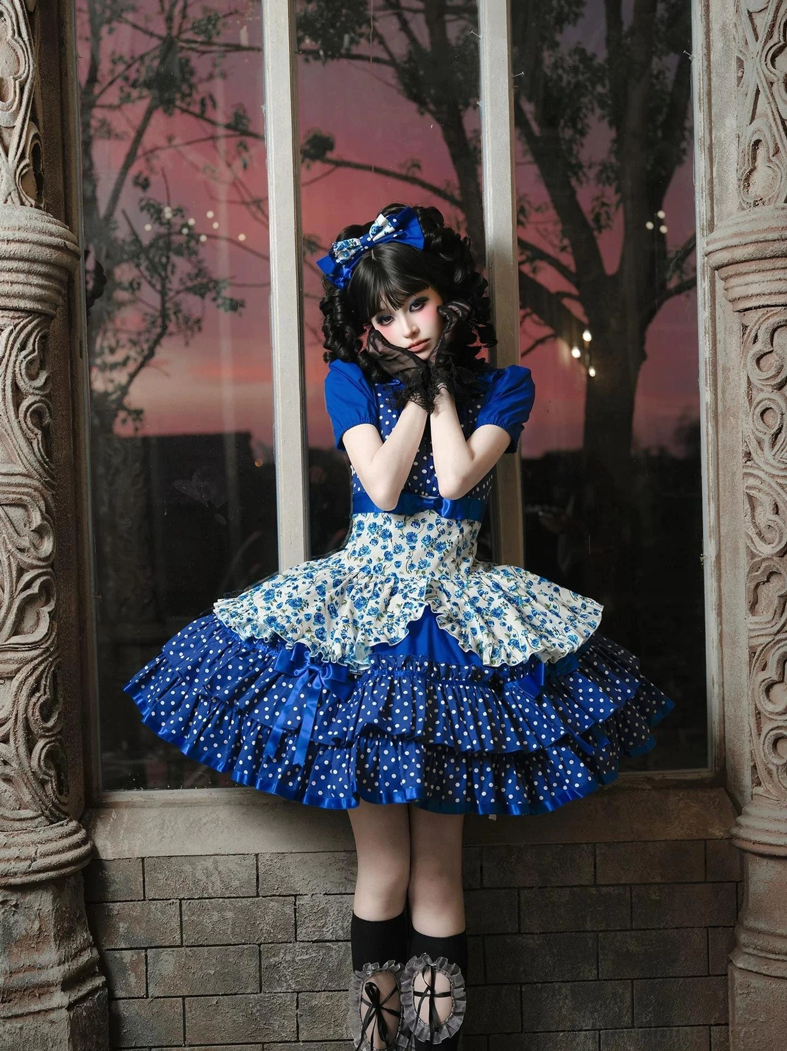 Blue polka dot and floral old school Lolita jumper skirt hem construction detail featuring multi-layered ruffles with satin ribbon trims and bow embellishments showcasing traditional Lolita aesthetic
