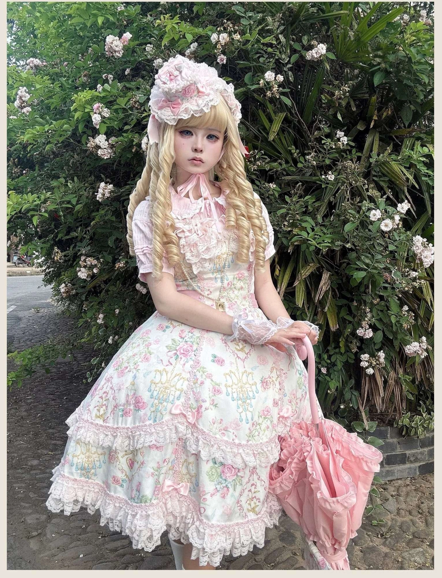 Old school Lolita JSK with short-sleeve inner blouse, matching bonnet and pink lace trims displayed in full front view with pink waist sash