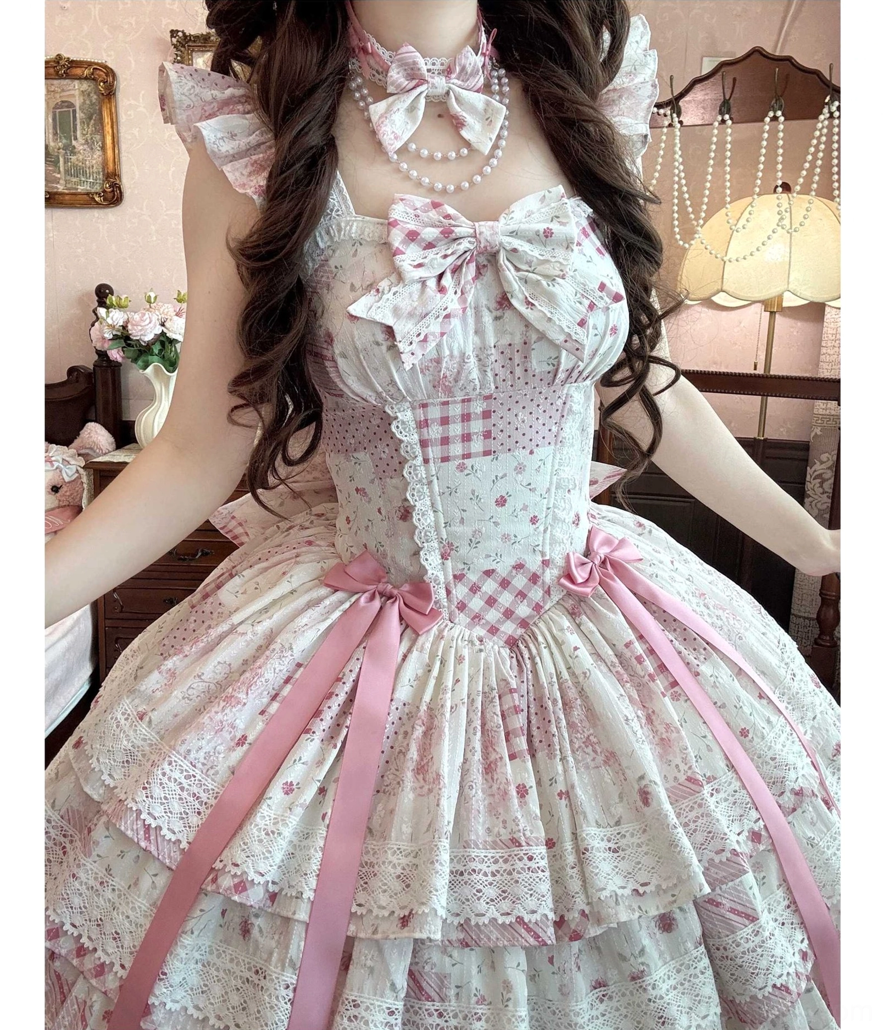 Delicate close-up shot of lolita JSK tiered ruffle hem detail with satin ribbon accents and embossed chiffon fabric texture highlighting craftsmanship