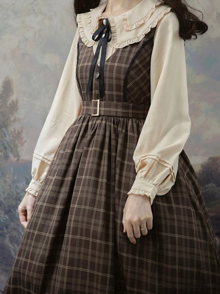 Close-up half-body view of lolita dress and peter pan collar blouse set showing lantern sleeves tartan plaid jumper dress front neck ribbon