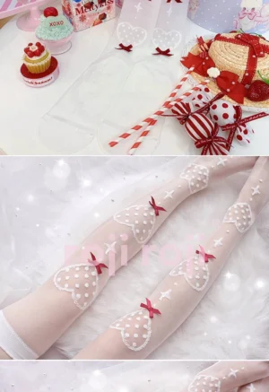 Close-up detailed view of ultra-thin Lolita knee socks featuring polka dot heart prints and decorative bows displayed on fluffy pink fabric background