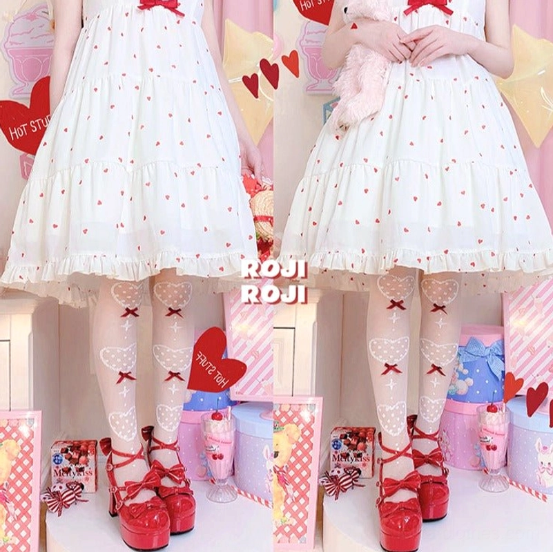 Dual model view of two girls wearing matching sheer Lolita knee socks with red bow cross heart patterns paired with red platform Mary Jane shoes