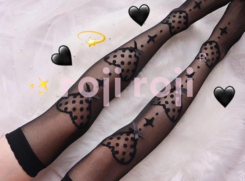 Close-up detail of Lolita knee socks featuring premium glass yarn material with visible heart and bow print texture and elasticated cuff construction