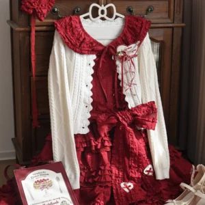 Two-tone vintage Lolita cardigan with lace-trimmed doll collar and large bow accent paired with burgundy ruffled JSK featuring heart embroidery detail