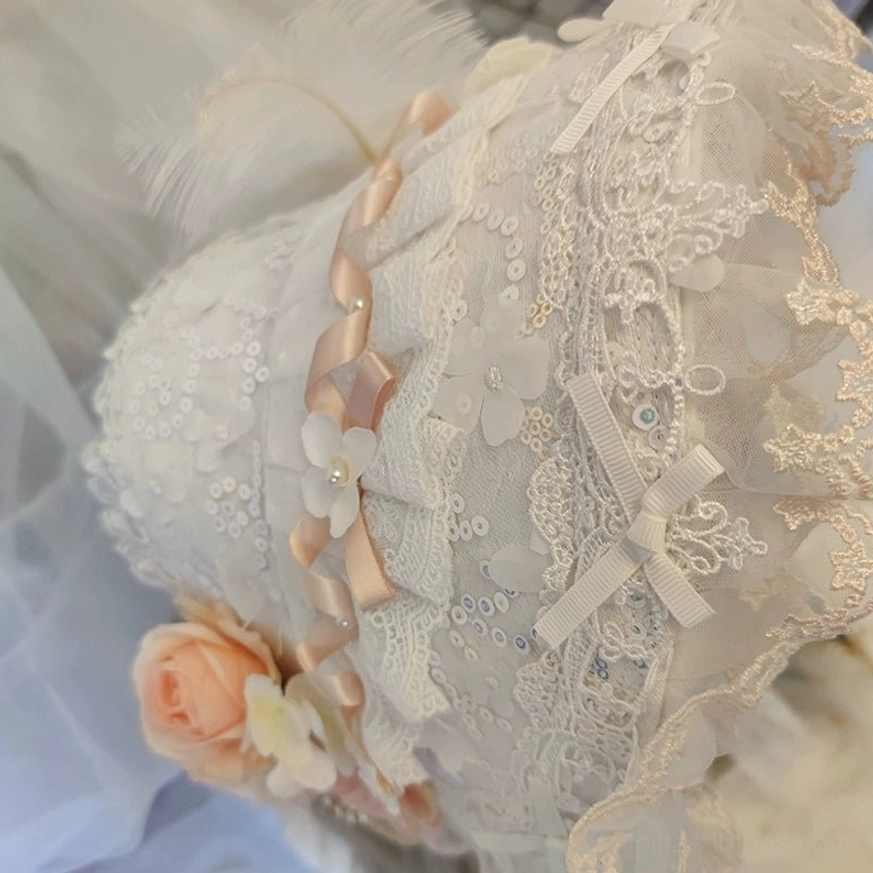 Lolita tea party lace accessory with sequined lace fabric, satin ribbon trim, tiny bows and artificial peach roses, side close-up view placed on soft tulle background, craftsmanship detail