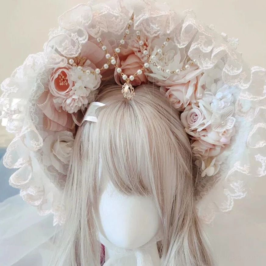 Elegant pink and white Lolita lace bonnet headdress with 1.2-meter veil, ruffled trim, artificial peach roses, and pearl gold gem ornaments displayed on mannequin with ash blonde wig, frontal overhead view