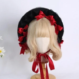 Elegant burgundy lolita headdress bonnet with ruffled lace trim and flowing chin ribbons mannequin styling