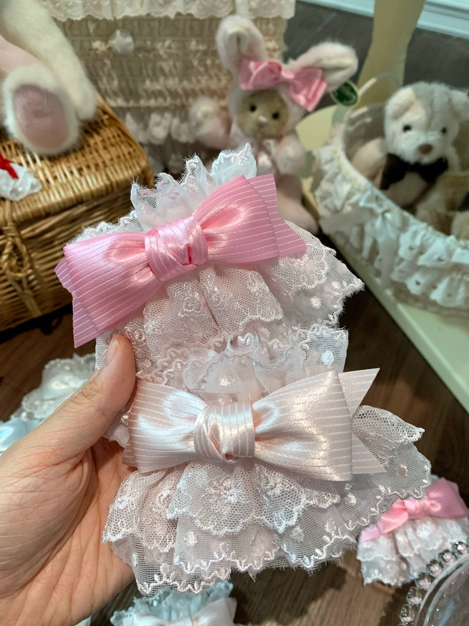 Close-up detail of Sweet Lolita elastic wrist cuffs with pink and white satin bows layered ruffle lace trim