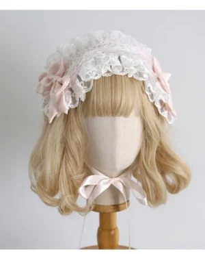 Delicate lolita lace headband with white frilled lace pink satin bows and neck ribbon attachment front mannequin display