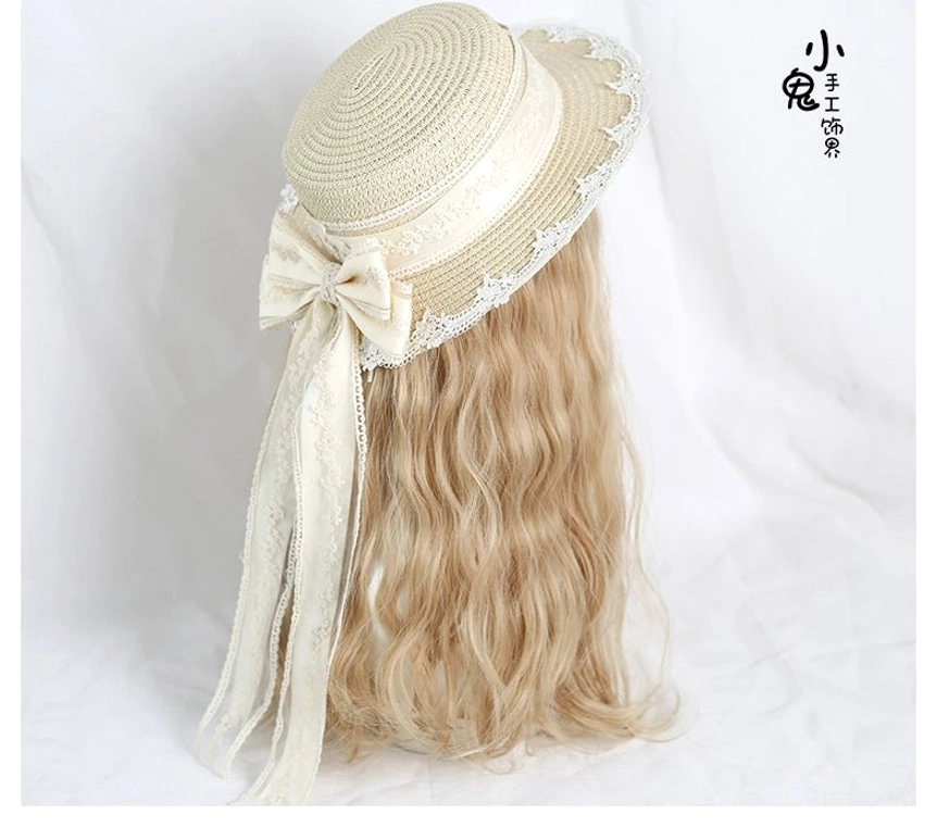 Lolita lace straw hat side-rear perspective showing side-mounted detachable bow with long flowing lace ribbons, compact rounded crown shape, and intricate lace trim along brim
