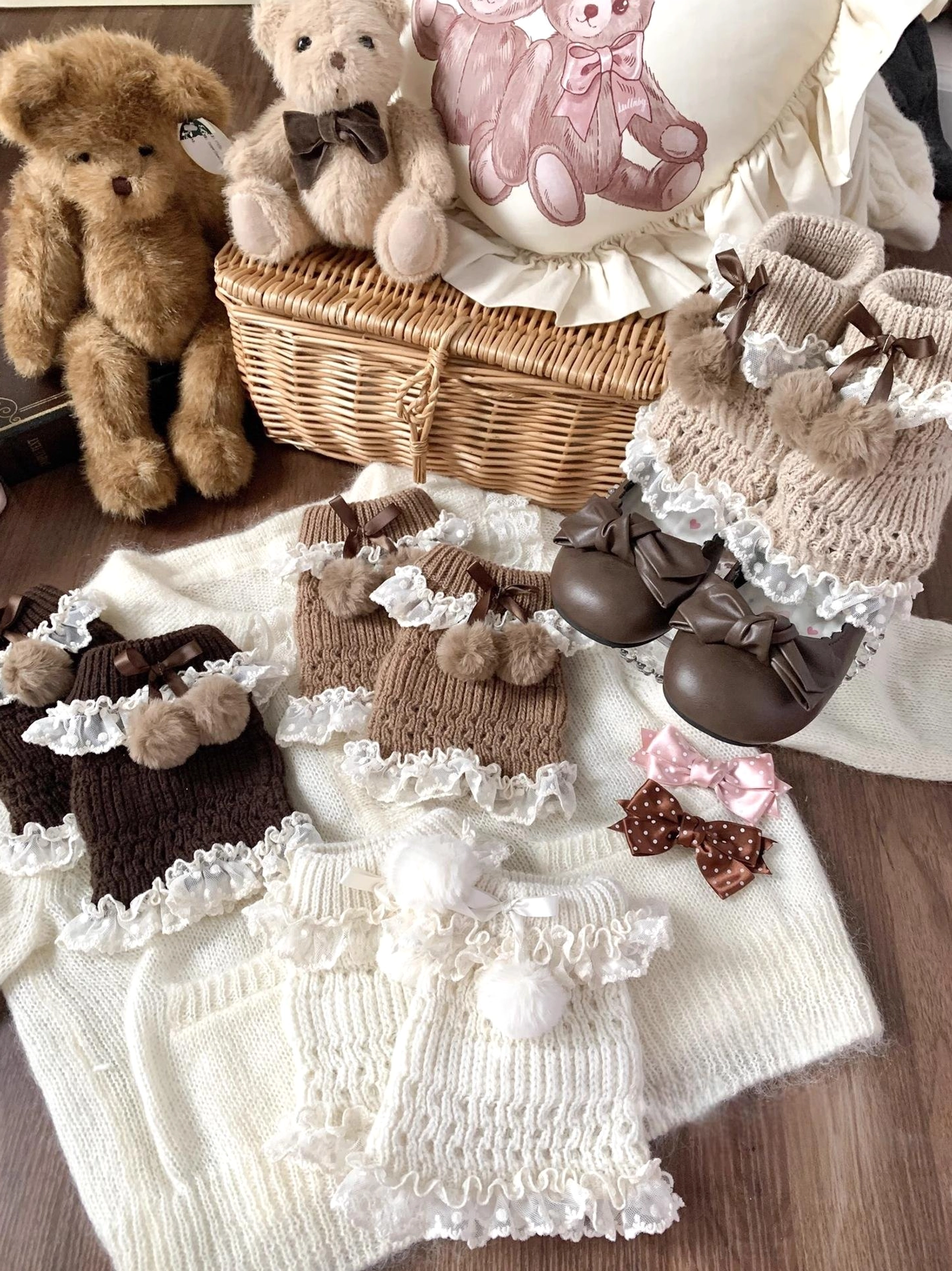 Kawaii lolita knit leg warmers with pom-pom bows and lace ruffles in multiple colors displayed on vintage dollhouse table setting with teddy bear props