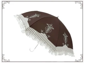 Classic Lolita parasol opened from three-quarter overhead view showing brown canopy with white scroll embroidery and striped ruffled lace hem trim with curved silver hook handle