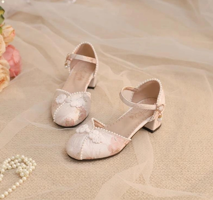 White Lolita Mary Jane chunky heel shoes close-up side view single foot pearl trim block heel