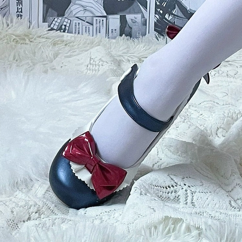 Lolita Mary Jane heels ankle strap mechanism showing functional heart-shaped buckle and secure fastening design