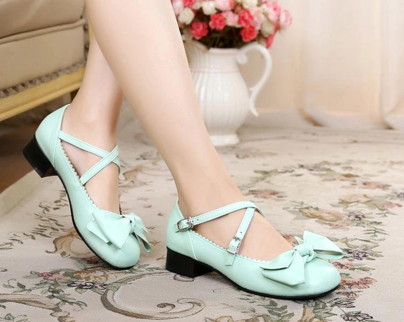 Coffee brown lolita bow cross-strap shoes side view displaying low heel and ankle straps