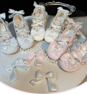 Collection of assorted Lolita Mary Jane shoes with interchangeable detachable heel bows displayed overhead with pearl ornaments showing round closed toe cross strap design multiple colorways