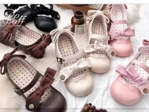 Lolita style Mary Jane flat shoes with double bows showing muted tone options rounded closed toe and branded printed insole overhead flat lay view
