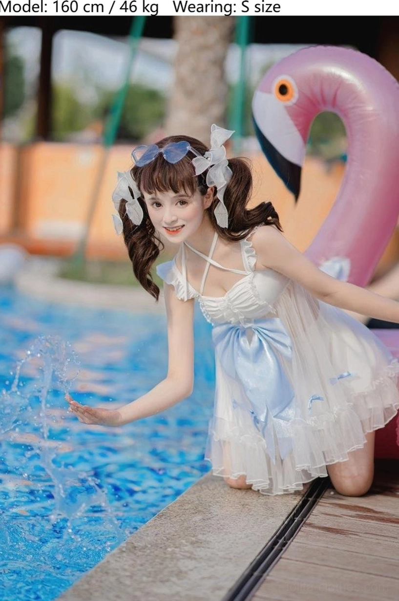 Lolita mermaid dreams swimwear kneeling wooden pool deck close-up three-quarter view short tulle dress large sky-blue waist bow hair accessories