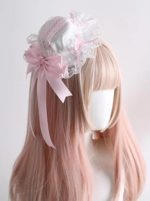 lolita mini top hat hair ornament with white lace decoration and pink satin bow embellished with pearls three-quarter view