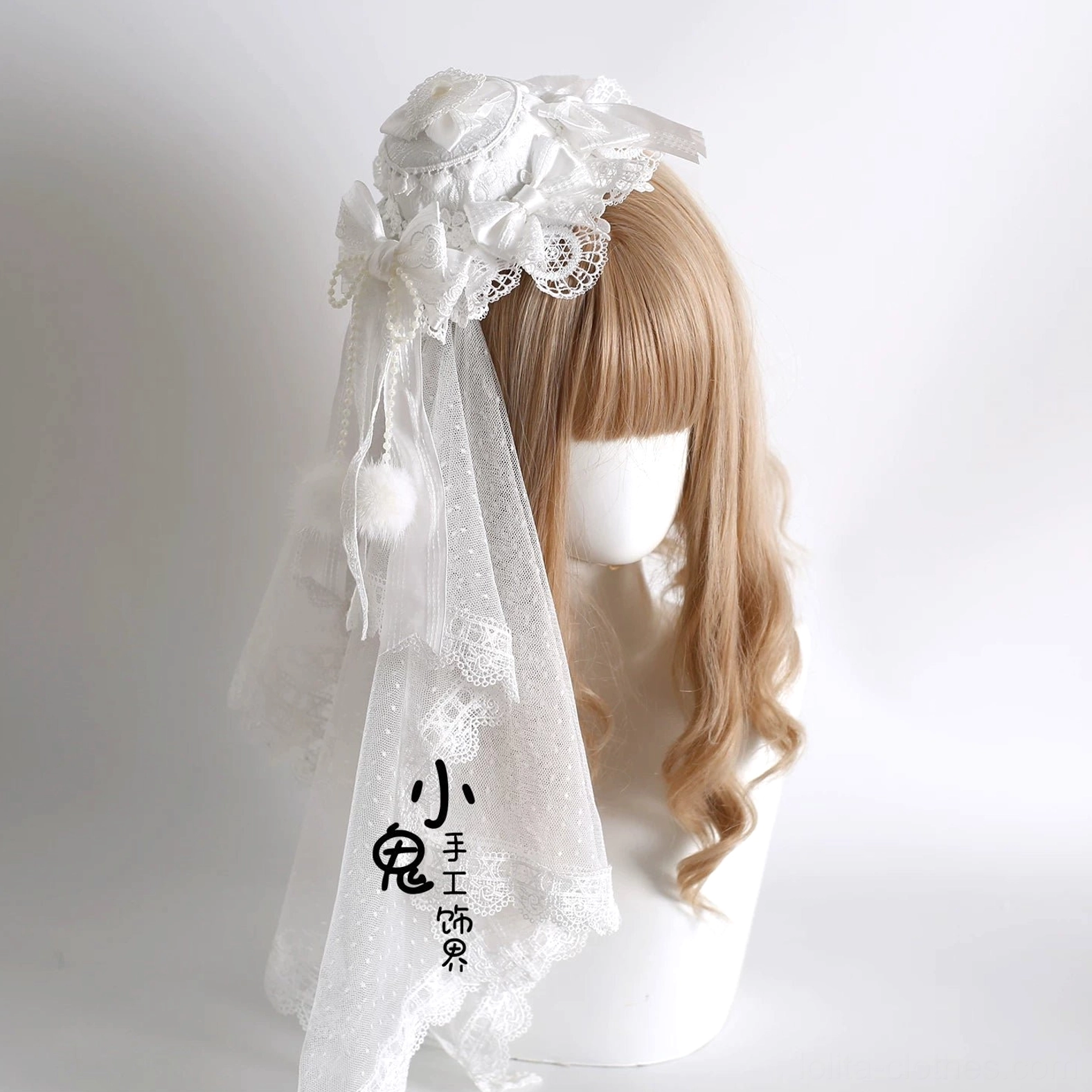 Lolita mini top hat with small head veil, lace-trimmed sheer overlay and pom-pom satin bow details, side profile display